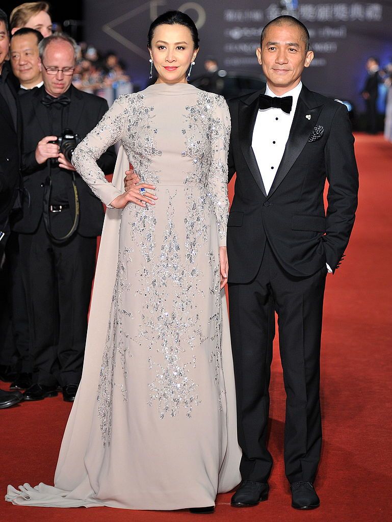 TAIPEI, TAIWAN - NOVEMBER 23: (CHINA OUT) Actress Carina Lau and actor Tony Leung Chiu-Wai arrive on the red carpet of the 50th Golden Horse Awards at Sun Yat-sen Memorial Hall on November 23, 2013 in Taipei, Taiwan. (Photo by Visual China Group via Getty Images/Visual China Group via Getty Images)