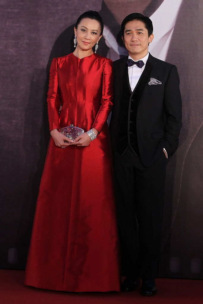HONG KONG - APRIL 13: (CHINA OUT) Carina Lau and Tony Leung Chiu Wai arrive at the red carpet of the 32nd Hong Kong Film Awards on April 13, 2013 in Hong Kong. (Photo by Visual China Group via Getty Images/Visual China Group via Getty Images)