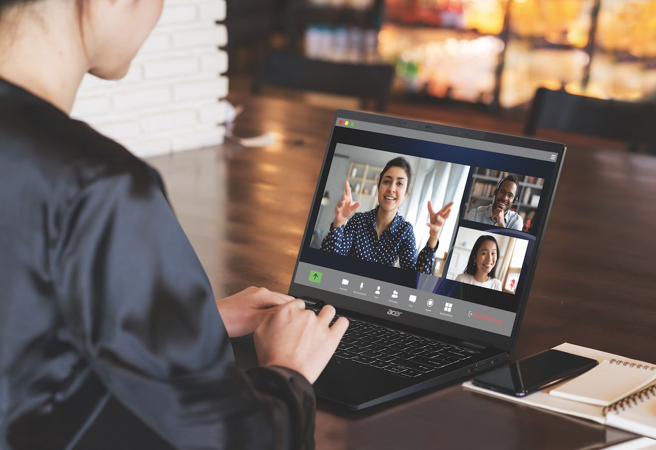 Back view of business woman talking about sale report in video conference. Asian team using laptop and tablet online meeting in video call.Working from home, Working remotely and Social isolation.; Shutterstock ID 1692335203; Purchase Order: -