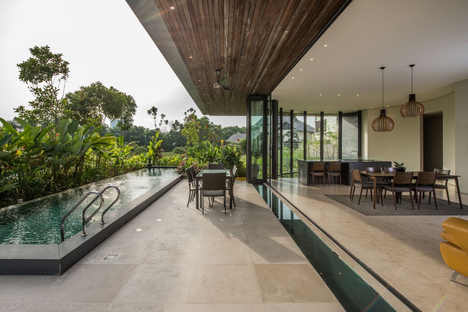 The living area open up to the pool area for seamless indoor outdoor living (Photo: Lin Ho)