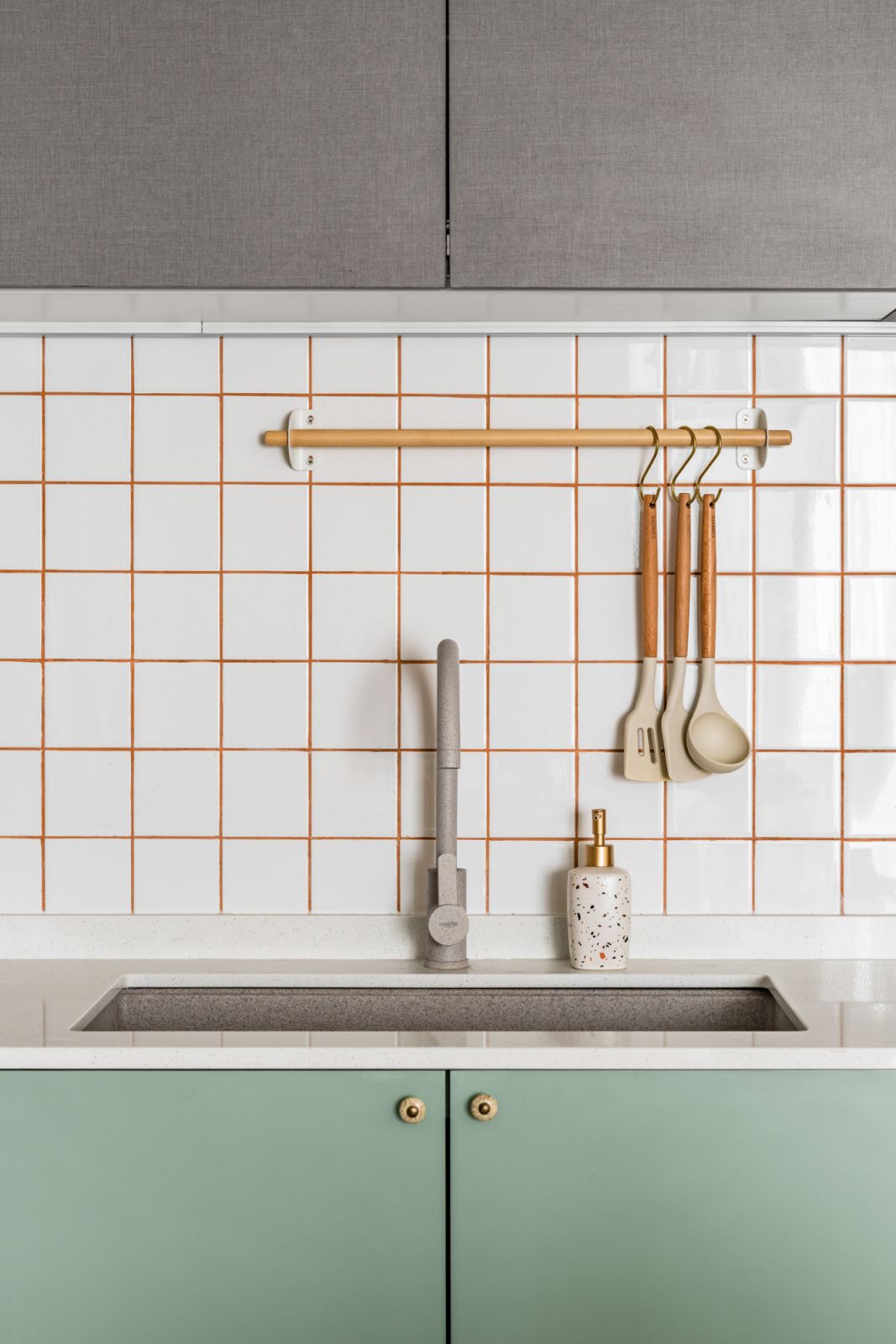 Orange grout picks up the colour of the living room