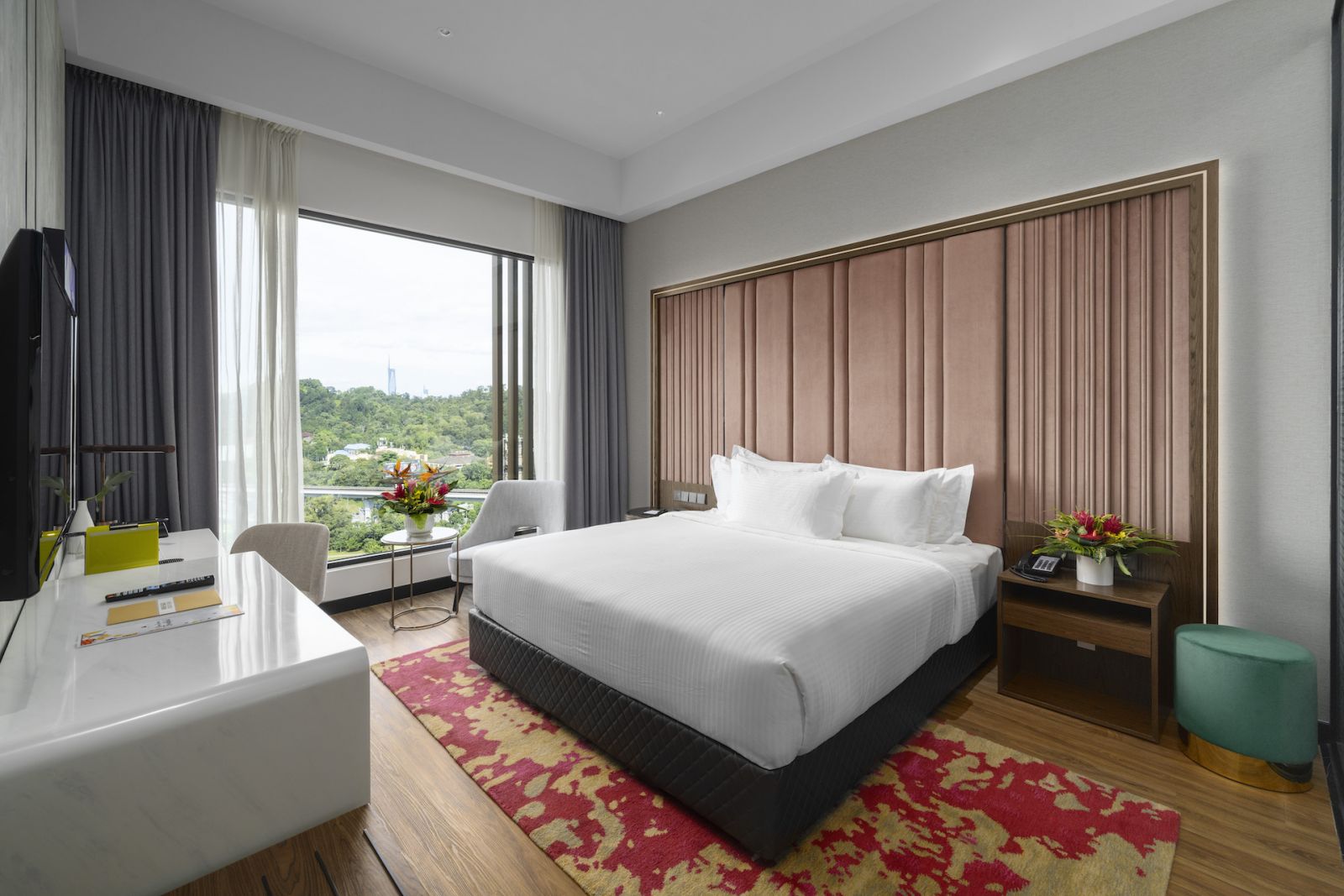 Soft salmon headboards in the Deluxe rooms