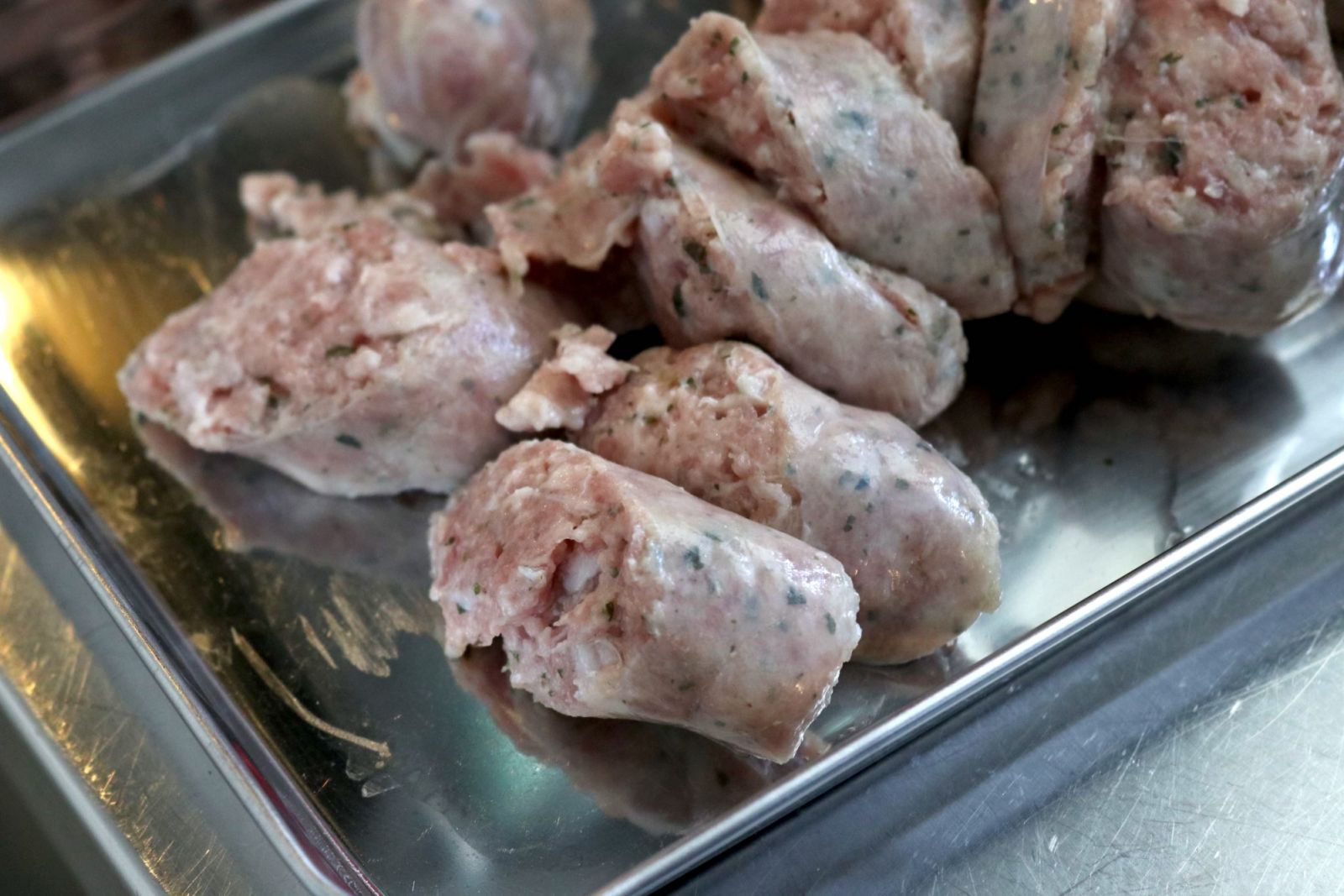 Slicing the Italian sausages while they were raw proved to be quite a challenge