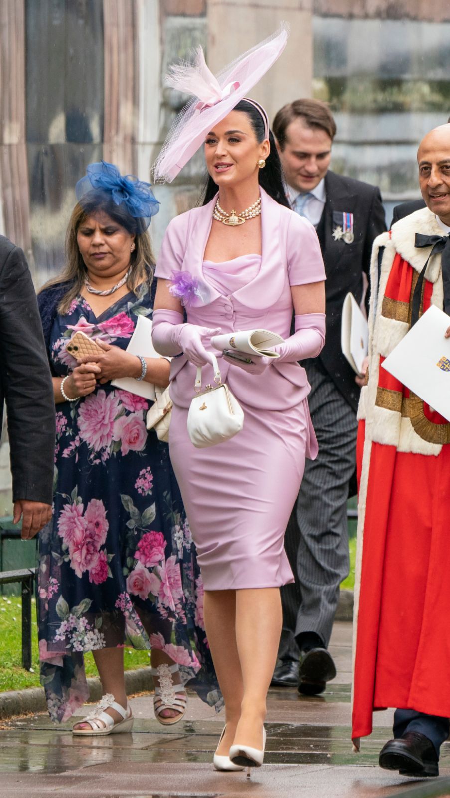 LONDON, ENGLAND - MAY 06: Katy Perry leaves Westminster Abbey following the coronation ceremony of King Charles III and Queen Camilla on May 6, 2023 in London, England. The Coronation of Charles III and his wife, Camilla, as King and Queen of the United Kingdom of Great Britain and Northern Ireland, and the other Commonwealth realms takes place at Westminster Abbey today. Charles acceded to the throne on 8 September 2022, upon the death of his mother, Elizabeth II. (Photo by Jane Barlow - WPA Pool/Getty Ima