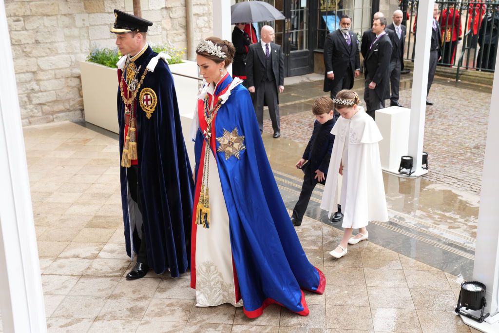 LONDON, ENGLAND - MAY 06: Prince William, Prince of Wales and Catherine, Princess of Wales with Prince Louis and Princess Charlotte arrive ahead of the Coronation of King Charles III and Queen Camilla on May 6, 2023 in London, England. The Coronation of Charles III and his wife, Camilla, as King and Queen of the United Kingdom of Great Britain and Northern Ireland, and the other Commonwealth realms takes place at Westminster Abbey today. Charles acceded to the throne on 8 September 2022, upon the death of h
