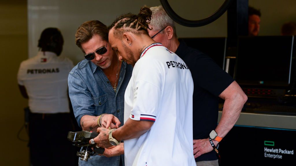 AUSTIN, TEXAS - OCTOBER 23: Lewis Hamilton of Great Britain and Mercedes meets Brad Pitt and Tim Cook in the garage prior to the F1 Grand Prix of USA at Circuit of The Americas on October 23, 2022 in Austin, Texas. (Photo by Mario Renzi - Formula 1/Formula 1 via Getty Images)