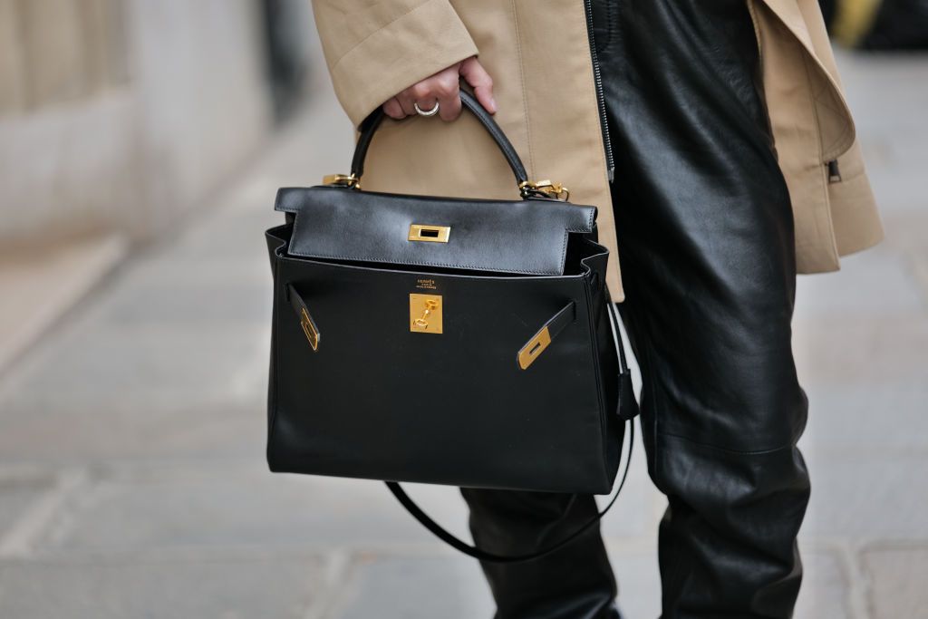 PARIS, FRANCE - MARCH 17: Diane Batoukina wears a black leather Hermes bag, during a street style fashion photo session, on March 17, 2023 in Paris, France. (Photo by Edward Berthelot/Getty Images)