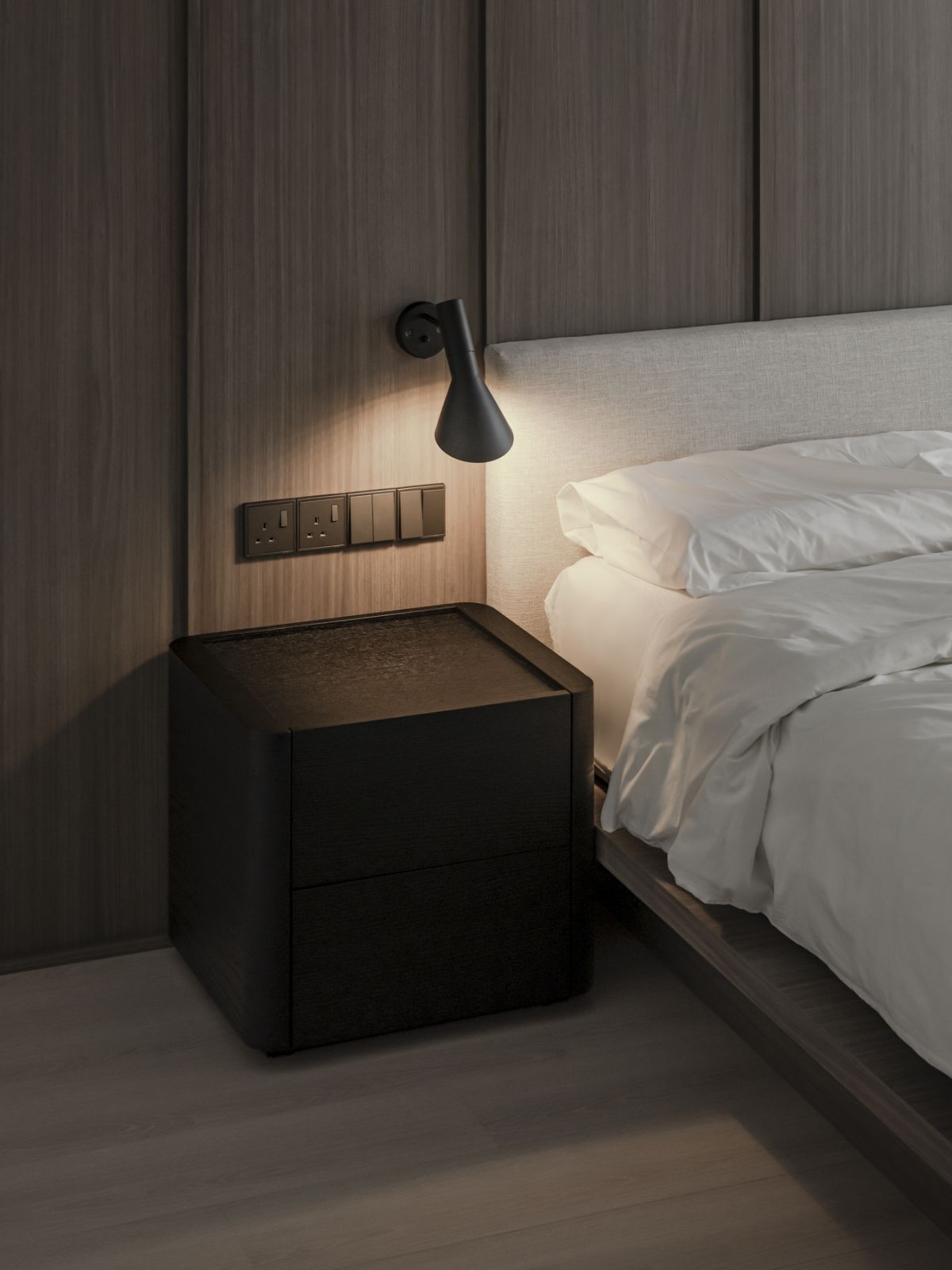 Black bedside lamps match the side tables