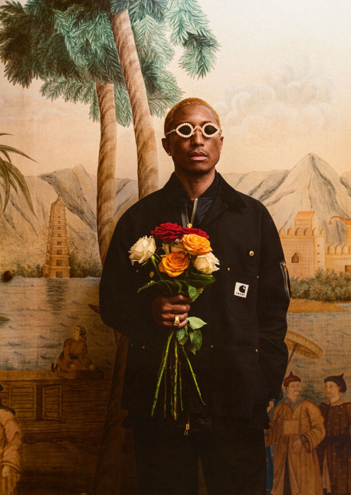 套裝 by Sacai x Carhartt WIP,太陽眼鏡 by Pharrell Williams x Tiffany & Co.;珠寶、手錶皆為 Pharrell 私物。(Photo: Lou Escobar for Tatler Hong Kong)