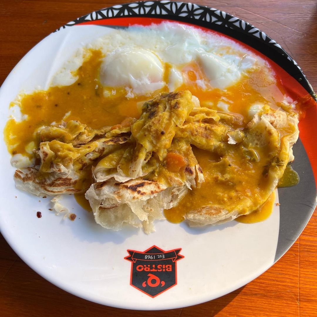 Q Bistro's fan favourite roti canai with half-boiled eggs and curry (Photo: Instagram/@yosoykamal)