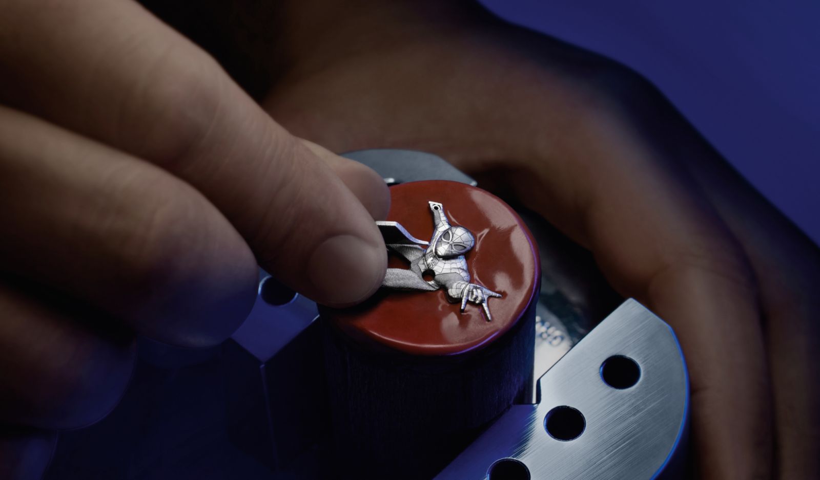 The Spider-Man figure is made from a single block of white gold