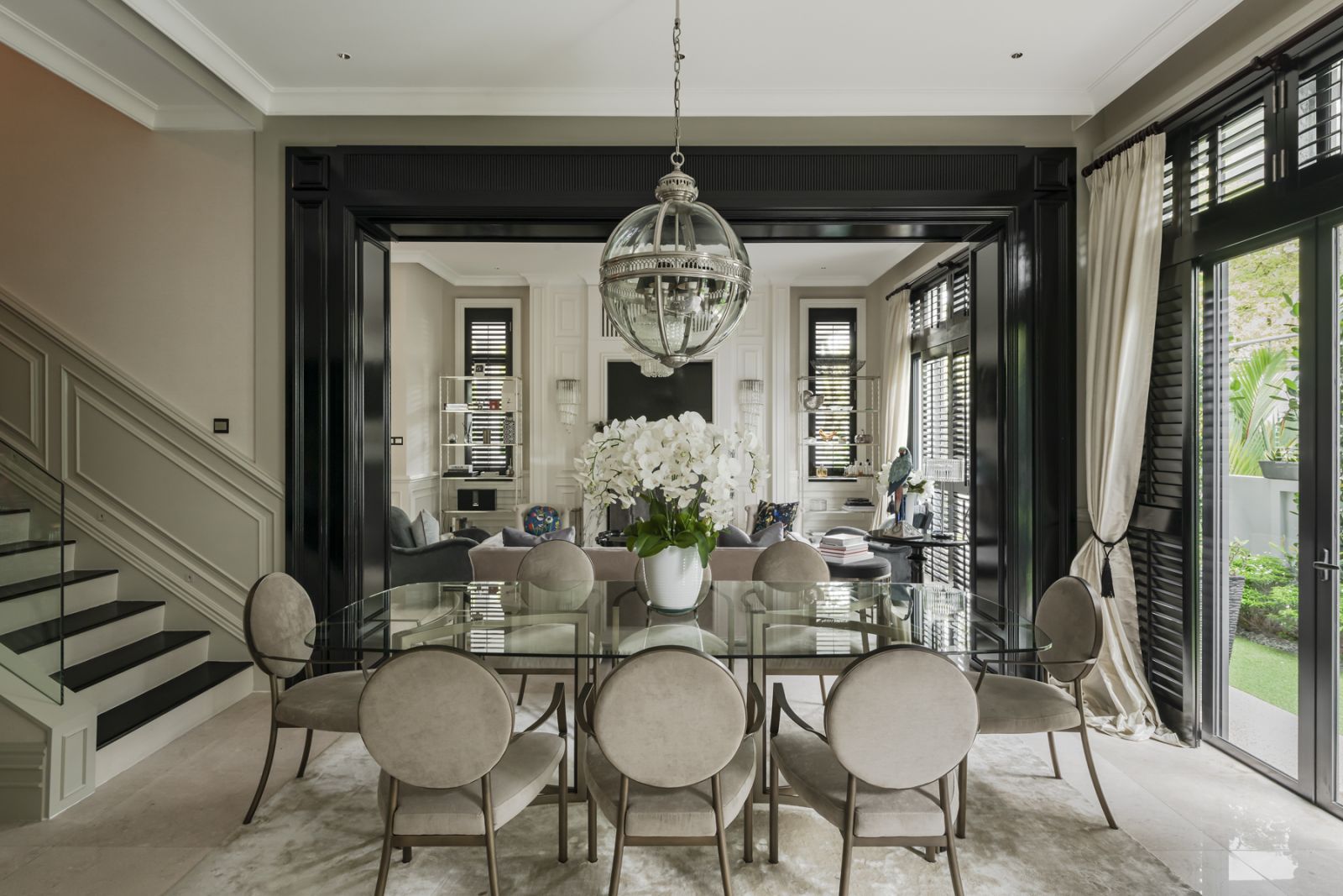 Natural light  streams into the elegant dining room