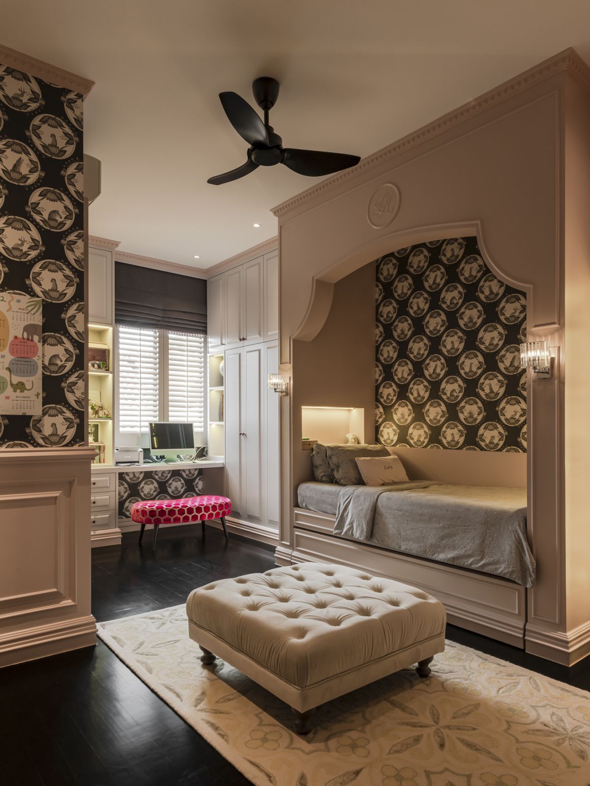 The pink built ins and monochromatic wallpaper make for a chic kid’s room