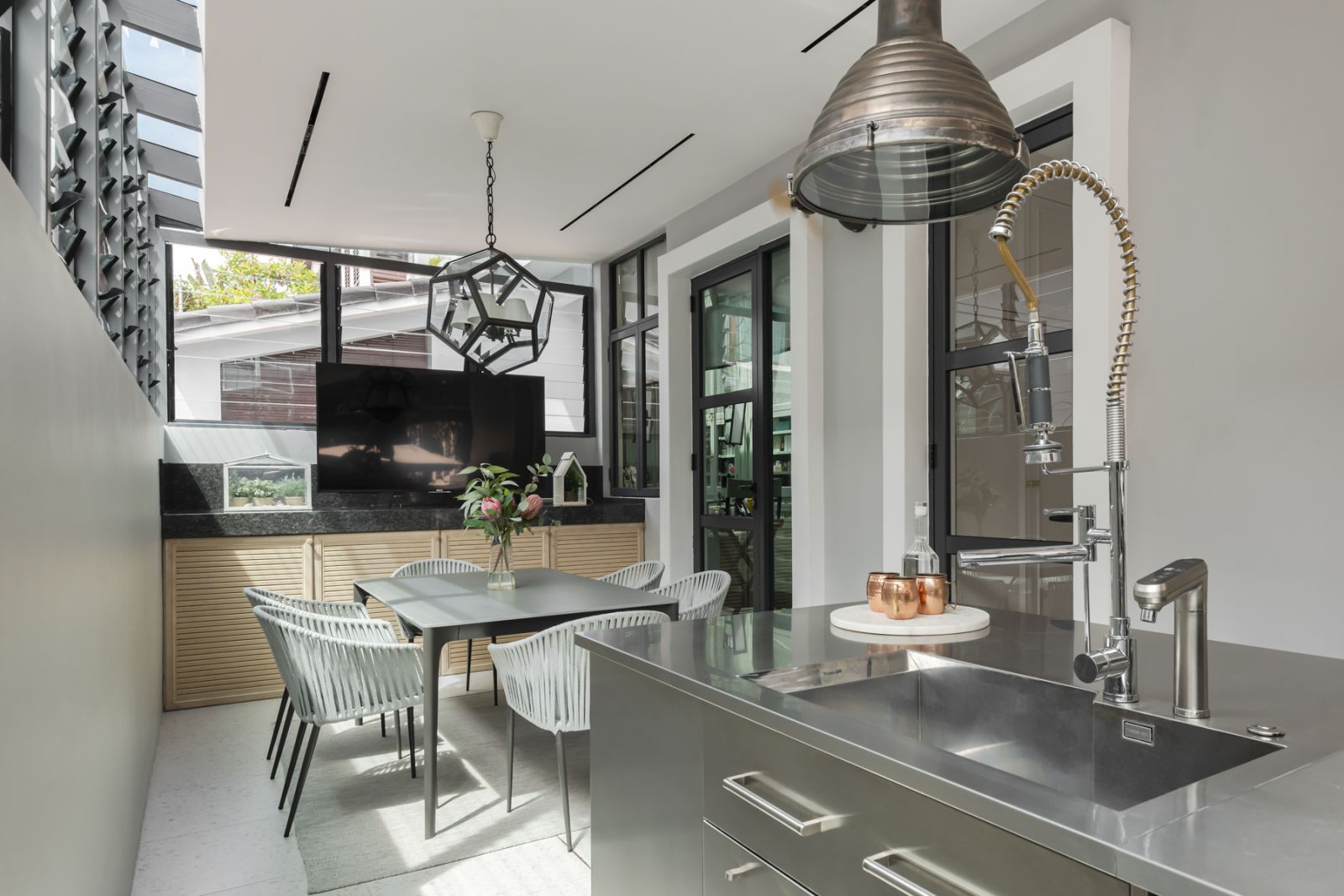 The wet kitchen was outfitted with stainless steel fixtures