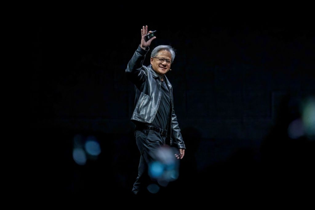 TAIPEI, TAIWAN - 2023/05/29: Nvidia president and CEO Jensen Huang enters the stage while waving to the audience at a keynote presentation at COMPUTEX. The COMPUTEX 2023 runs from 30 May to 02 June 2023 and gathers over 1,000 exhibitors from 26 different countries with 3000 booths to display their latest products and to sign orders with foreign buyers. (Photo by Walid Berrazeg/SOPA Images/LightRocket via Getty Images)