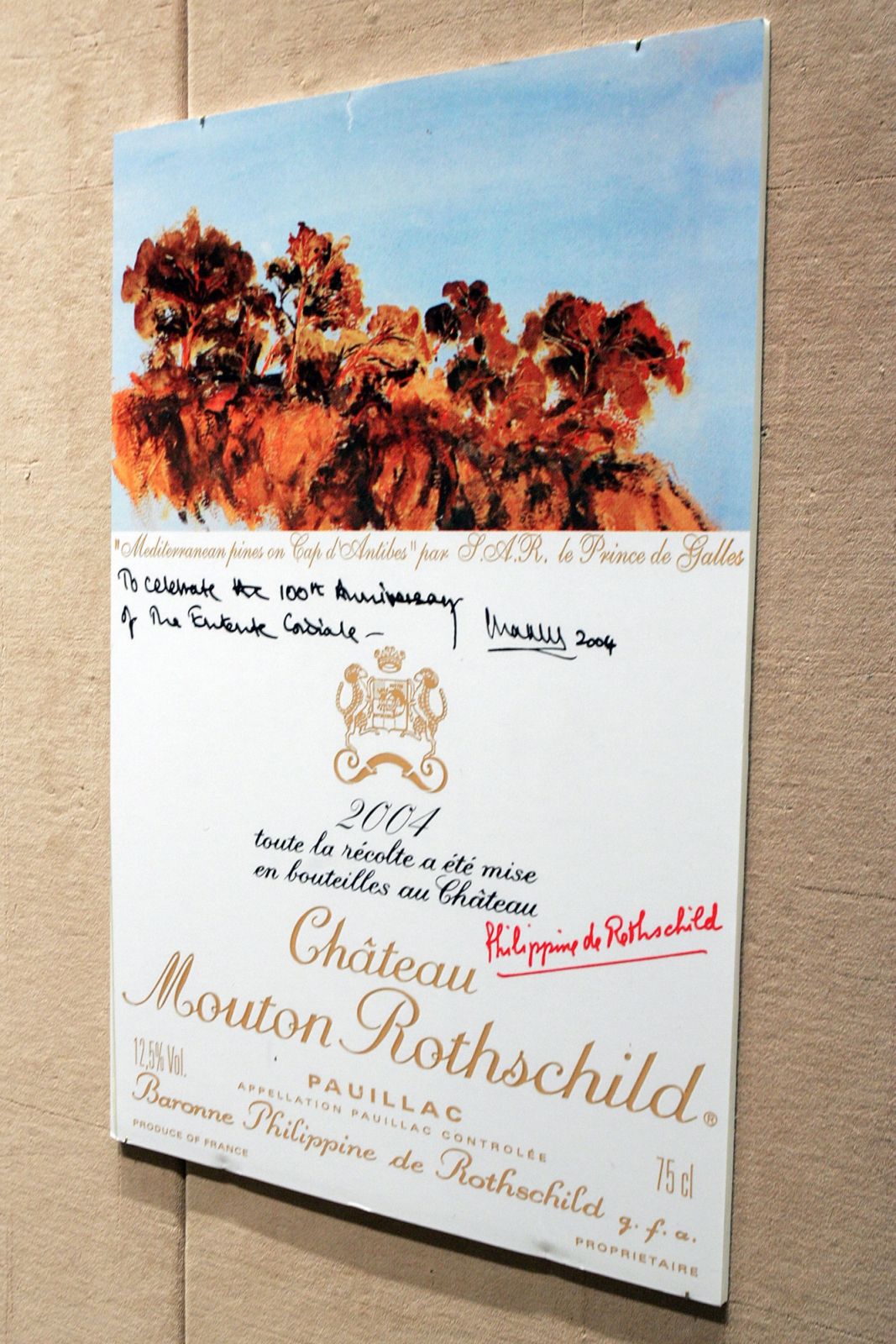 NEW YORK - FEBRUARY 28: A poster for the label for 2004 Chateau Mouton Rothschild that Prince Charles illustrated is on display during the Chateau Mouton Rothschild auction at Sotheby's auction house on February 28, 2007 in New York City. (Photo by Bryan Bedder/Getty Images)