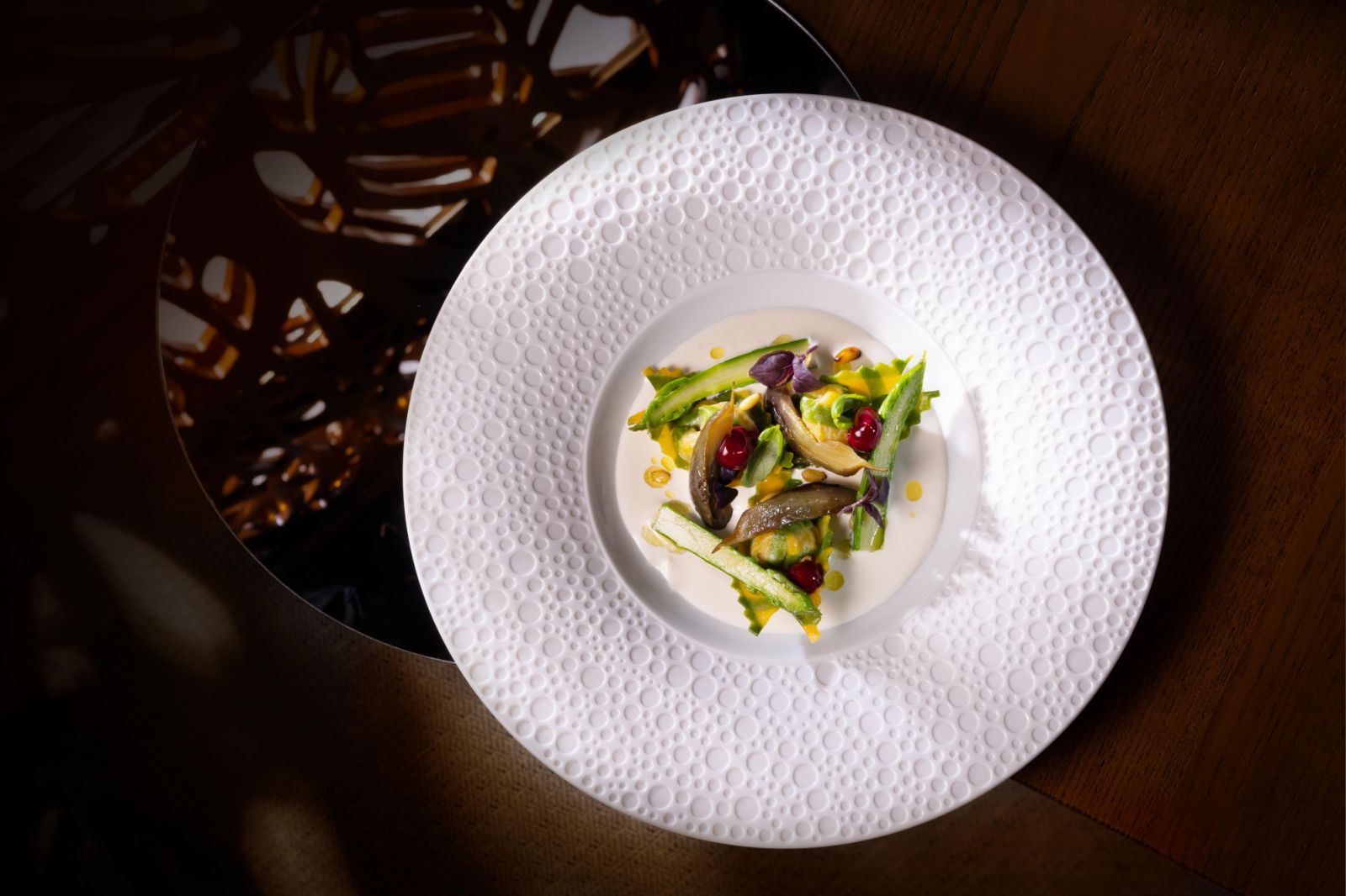 Kale and beetroot cappellacci with smoked stracciatella fondue, pine nut and wild asparagus