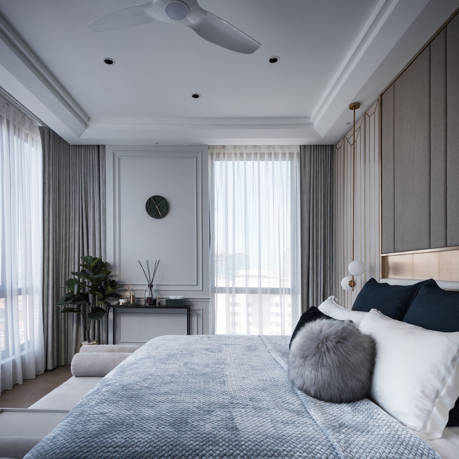The soothing colour palette continues in the bedroom
