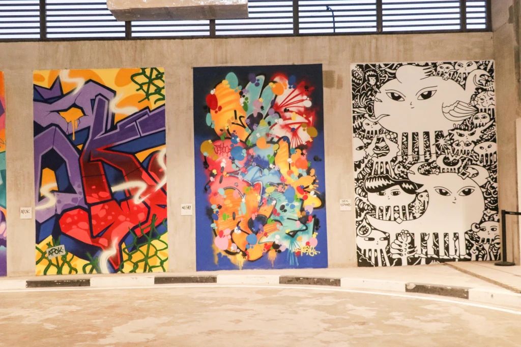 Murals by artists from left: Apok, Nebay and Dex Fernandez. OFF THE WALL MANILA PARIS CONNEXIONS murals at the ONE AYALA Terminal Hub was inaugurated last December 2, 2022. (Photo: Jude Bautista)