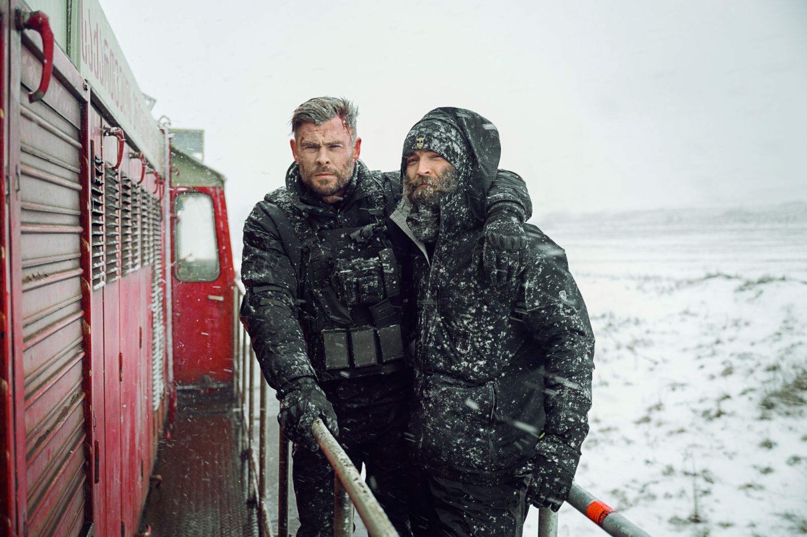 Extraction 2. (L-R) Chris Hemsworth as Tyler Rake and Director Sam Hargrave on the set of Extraction 2. Cr. Jasin Boland/Netflix © 2023