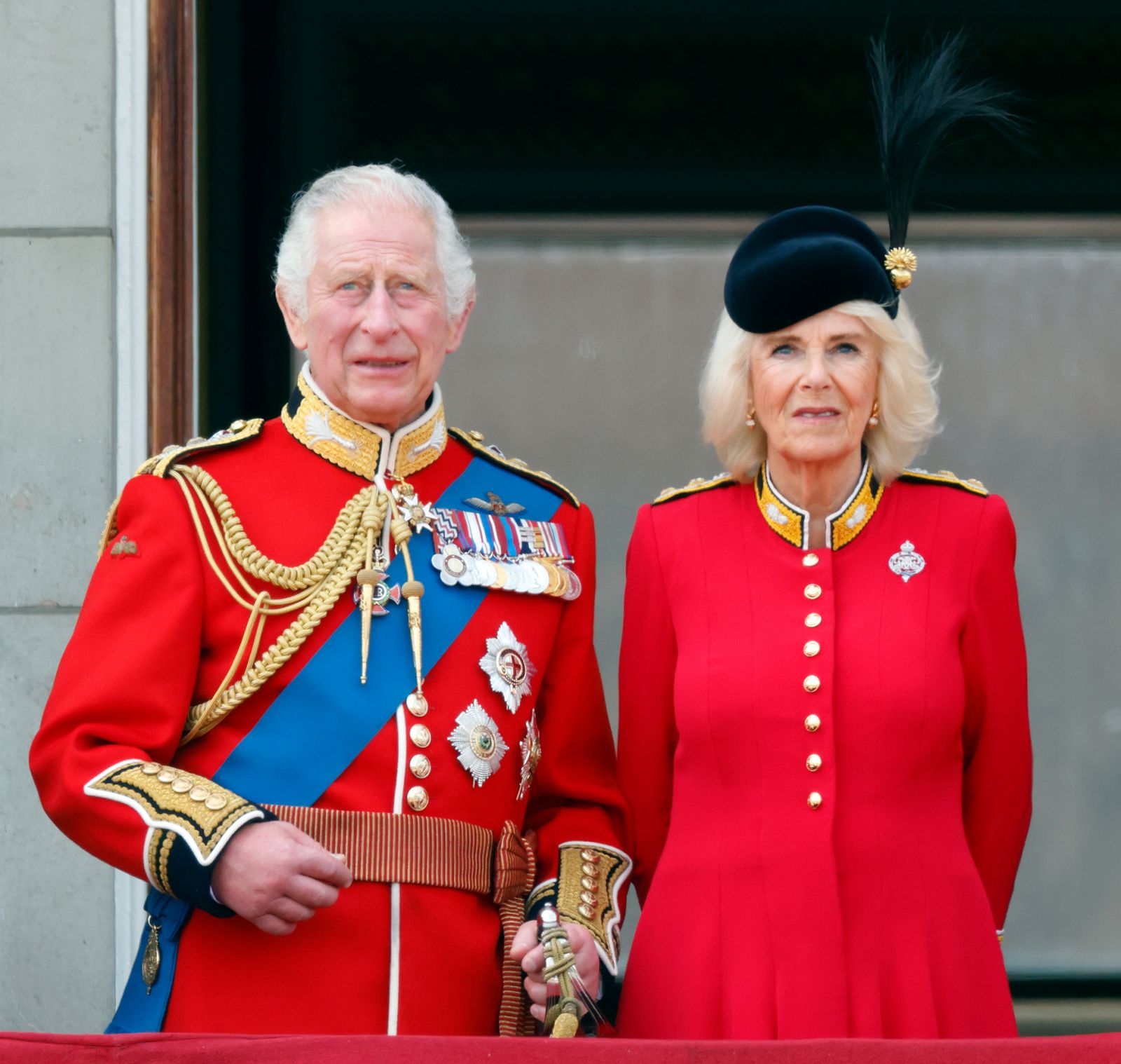 LONDON, UNITED KINGDOM - JUNE 17: (EMBARGOED FOR PUBLICATION IN UK NEWSPAPERS UNTIL 24 HOURS AFTER CREATE DATE AND TIME) King Charles III (wearing his Welsh Guards uniform) and Queen Camilla (Colonel of the Grenadier Guards) watch an RAF flypast from the balcony of Buckingham Palace during Trooping the Colour on June 17, 2023 in London, England. Trooping the Colour is a traditional military parade held at Horse Guards Parade to mark the British Sovereign's official birthday. It will be the first Trooping th