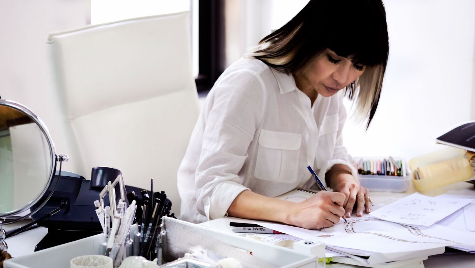 Mimi at work on her designs (Photo: courtesy of Mimi So)