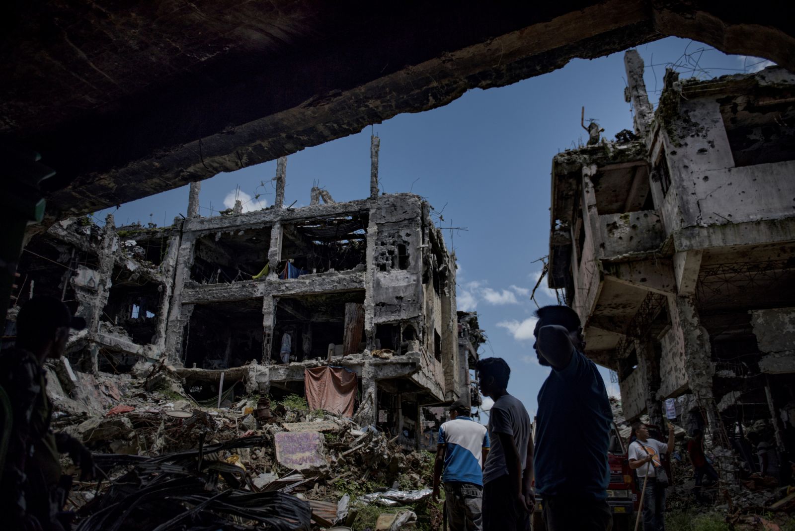 Marawi residents salvage any usable items they can find from what is left of their homes as they were allowed to enter for three days in what used to be the main battle area during the war, on May 10, 2018 in Marawi, Philippines. (Photo by Jes Aznar/Getty Images)