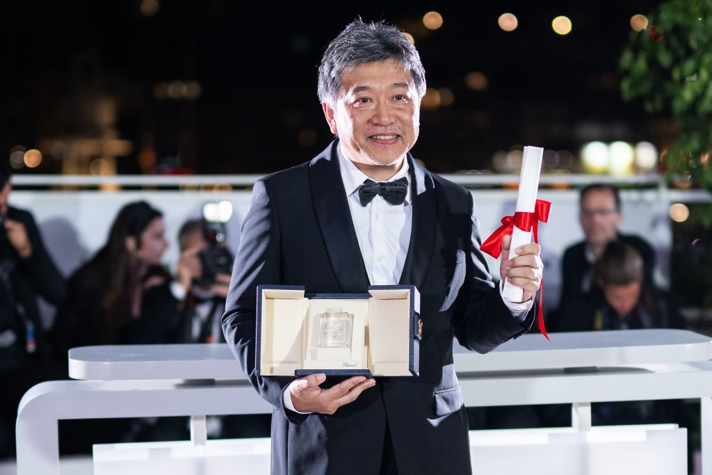 CANNES, FRANCE - MAY 27: Hirokazu Kore-eda poses with the The Award for Best Screenplay for 'Kaibutsu' (Monster) during the Palme D'Or winners photocall at the 76th annual Cannes film festival at Palais des Festivals on May 27, 2023 in Cannes, France. (Photo by Lionel Hahn/Getty Images)