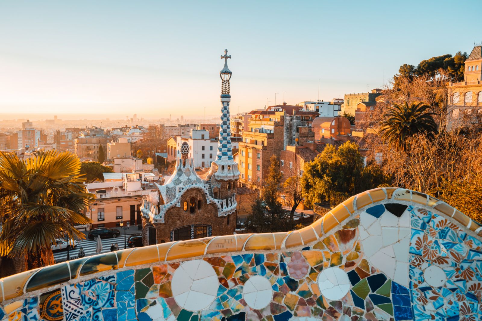 View of the city from Park Guell in Barcelona, Spain with sunrise colors.