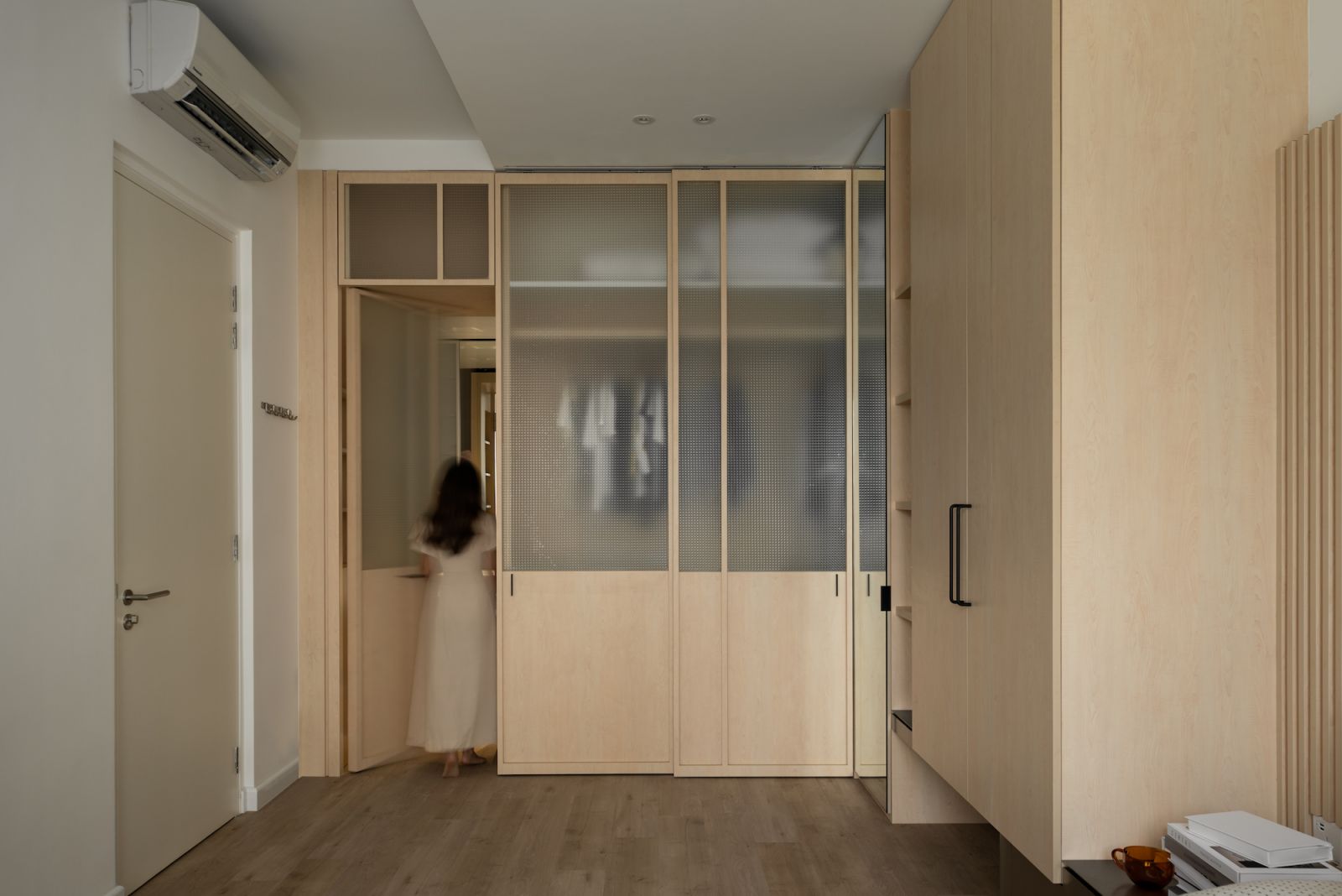 The walk in wardrobe is concealed behind doors