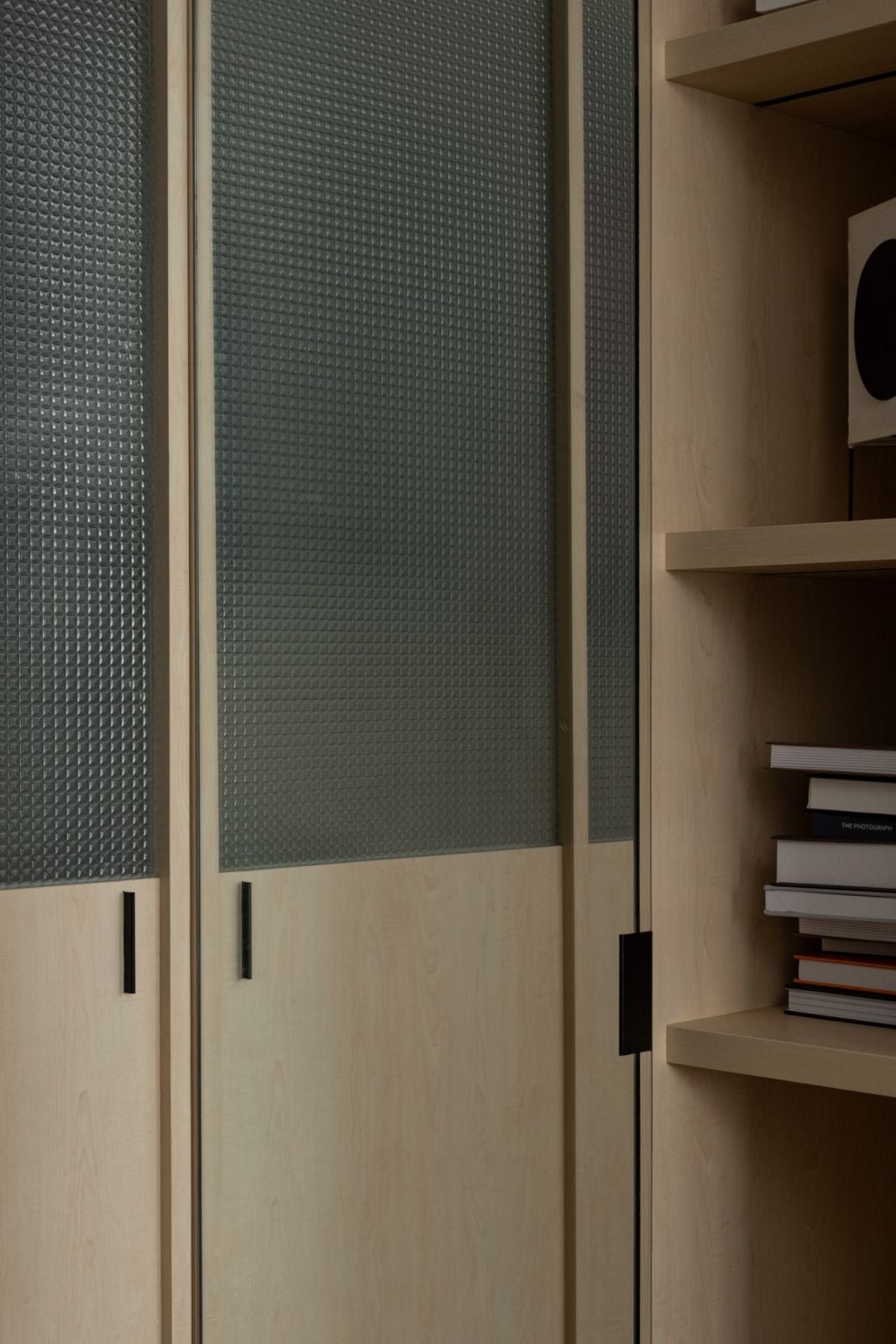 The walk in wardrobe is concealed behind doors