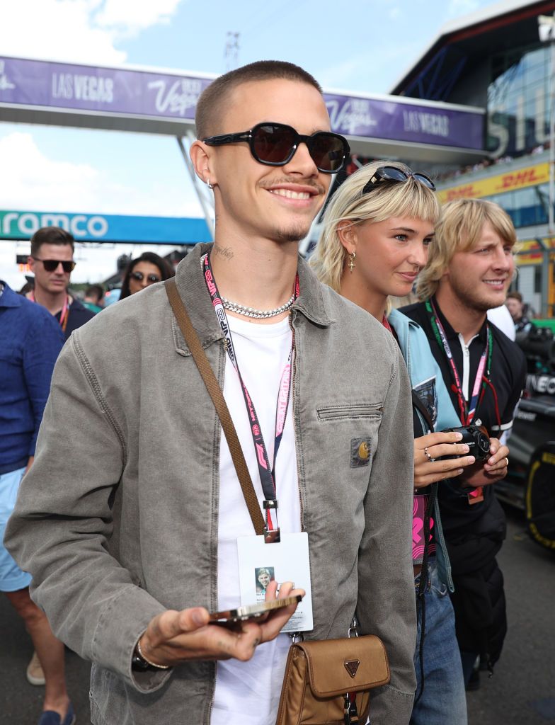 NORTHAMPTON, ENGLAND - JULY 09: Romeo Beckham and Mia Regan walk on the grid during the F1 Grand Prix of Great Britain at Silverstone Circuit on July 09, 2023 in Northampton, England. (Photo by Ryan Pierse/Getty Images)