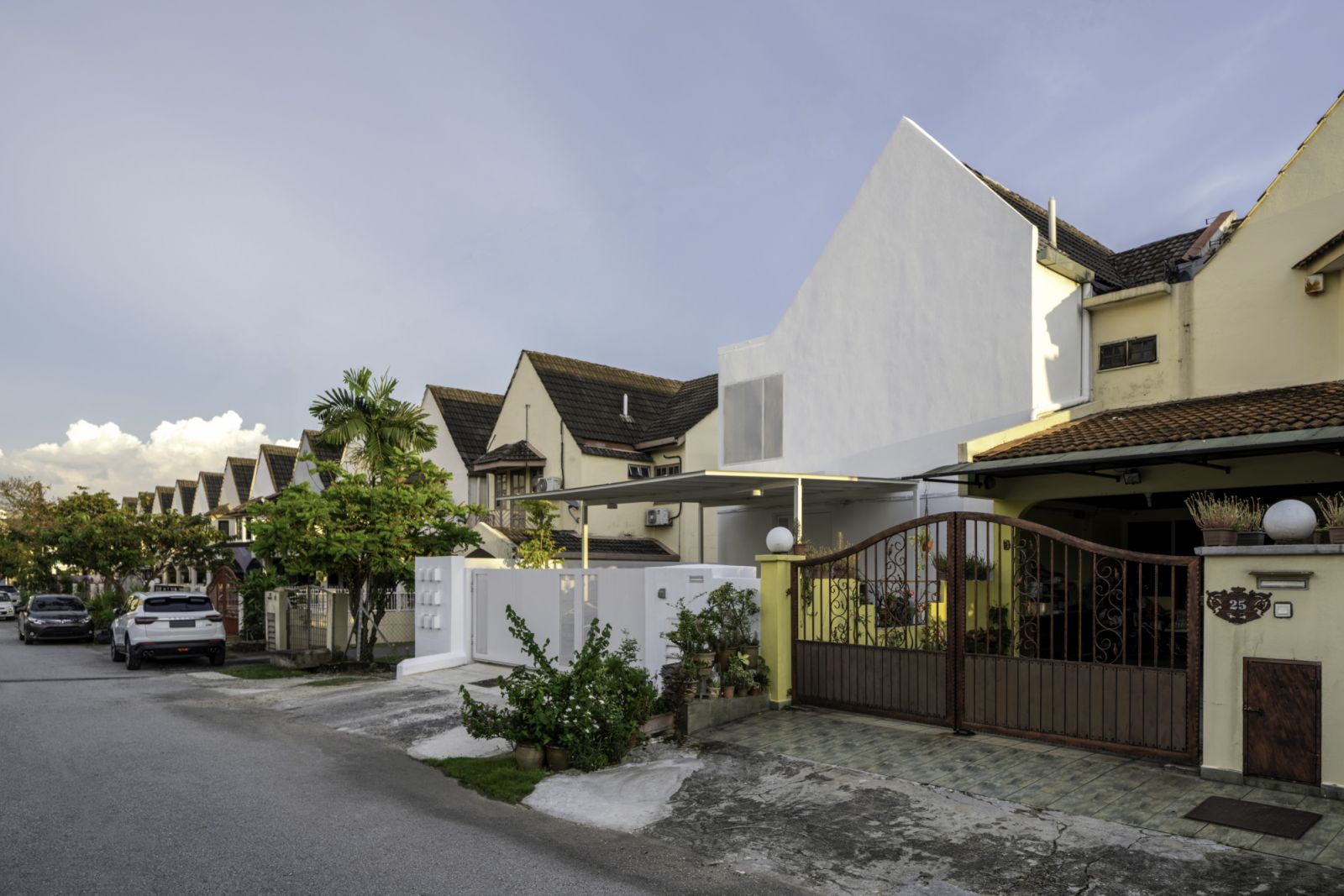 The all white facade of Insight house stands out in the neighbourhood