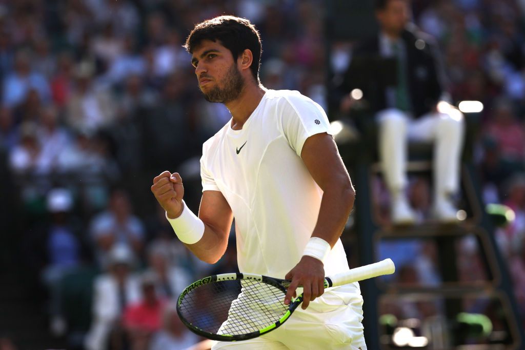 LONDON, ENGLAND - JULY 12: Carlos Alcaraz of Spain celebrates against Holger Rune of Denmark in the Men's Singles Quarter Final match during day ten of The Championships Wimbledon 2023 at All England Lawn Tennis and Croquet Club on July 12, 2023 in London, England. (Photo by Patrick Smith/Getty Images)