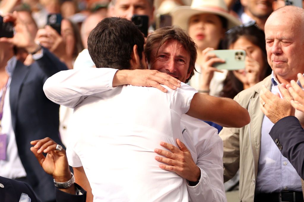 LONDON, ENGLAND - JULY 16: Carlos Alcaraz of Spain celebrates victory with his coach, Juan Carlos Ferrero following the Men's Singles Final against Novak Djokovic of Serbia on day fourteen of The Championships Wimbledon 2023 at All England Lawn Tennis and Croquet Club on July 16, 2023 in London, England. (Photo by Clive Brunskill/Getty Images)