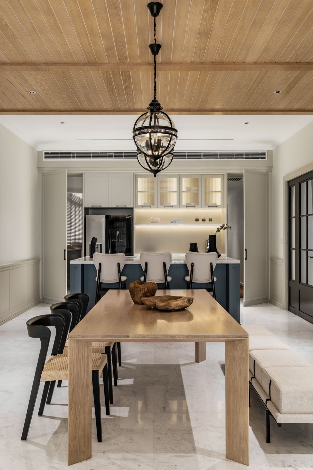The custom oversized table is made from solid oak