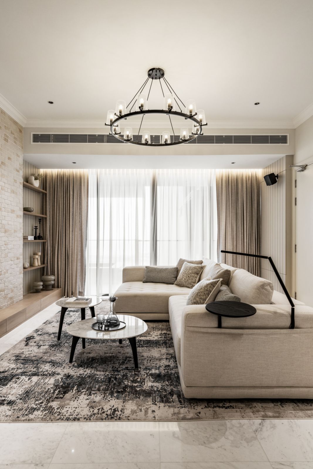 A minimalist iron chandelier takes pride of place