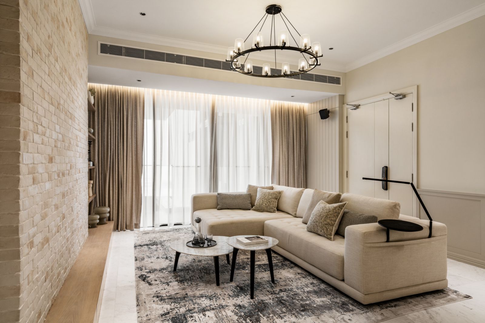 A minimalist iron chandelier takes pride of place