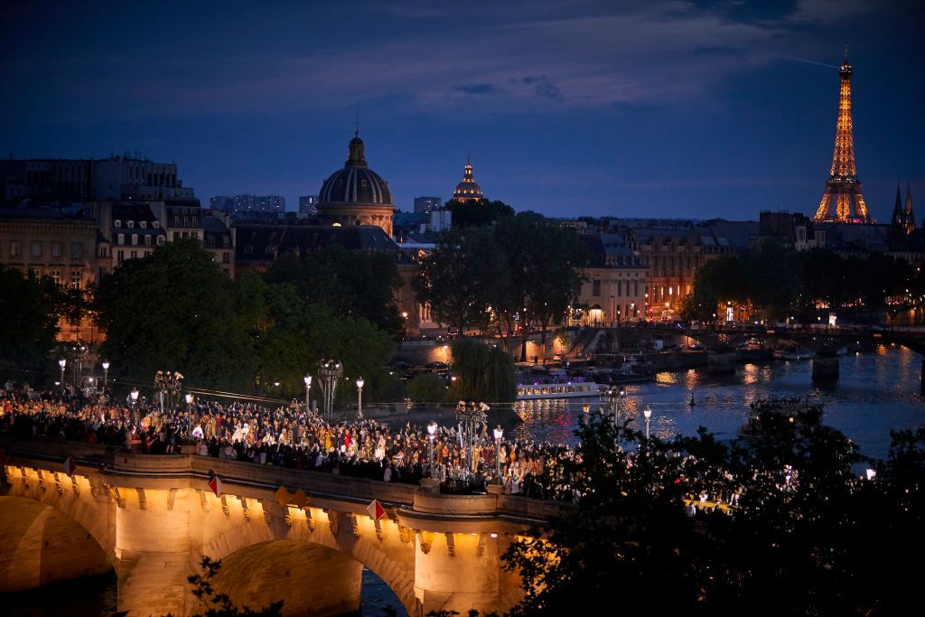 PARIS, FRANCE - JUNE 20: Models parade down Pont Neuf Bridge during the Louis Vuitton Menswear Spring/Summer 2024 show as part of Paris Fashion Week on June 20, 2023 in Paris, France. (Photo by Kiran Ridley/Getty Images)