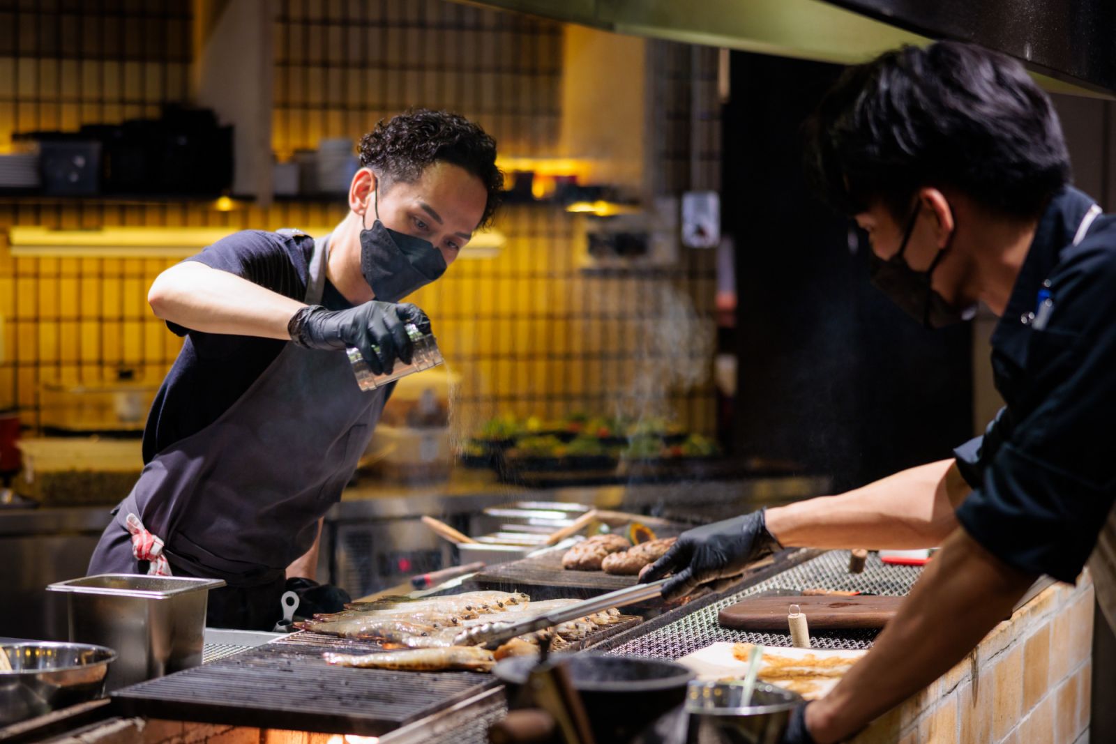 Chef Kiga prepares the food in the open kitchen concept of Gyu San Japanese Sando and Charcoal Bar (Photo: Adrian Lee)