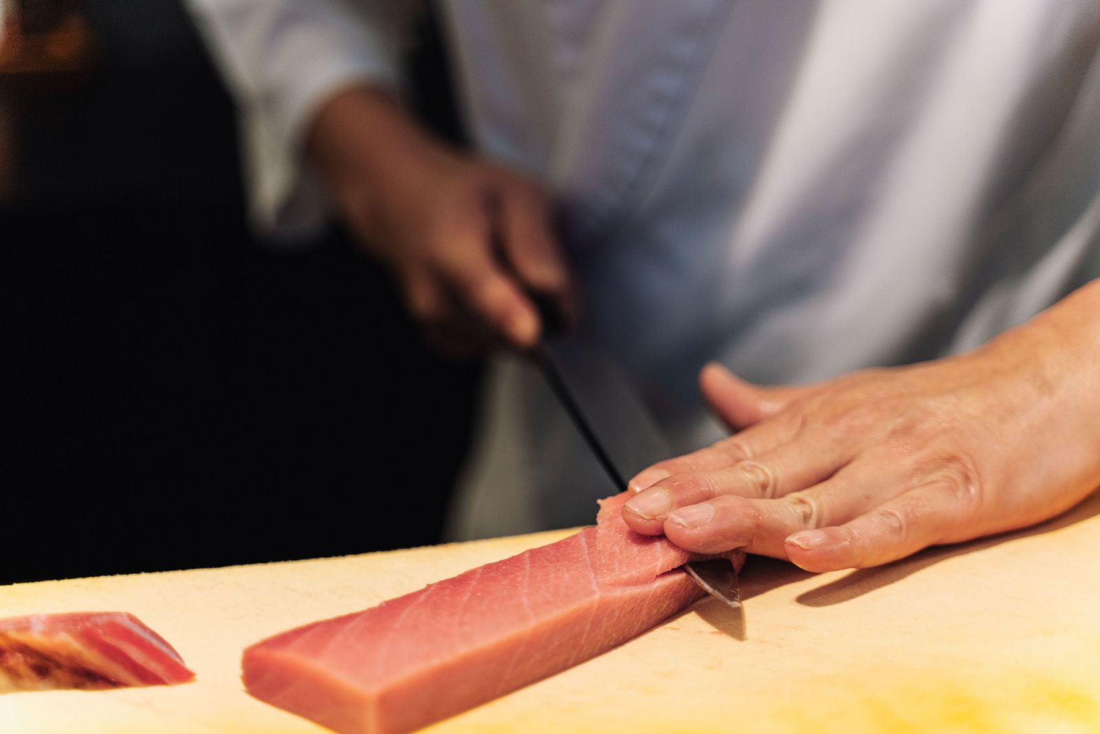 Slicing fish for sushi and sashimi takes focus and precision