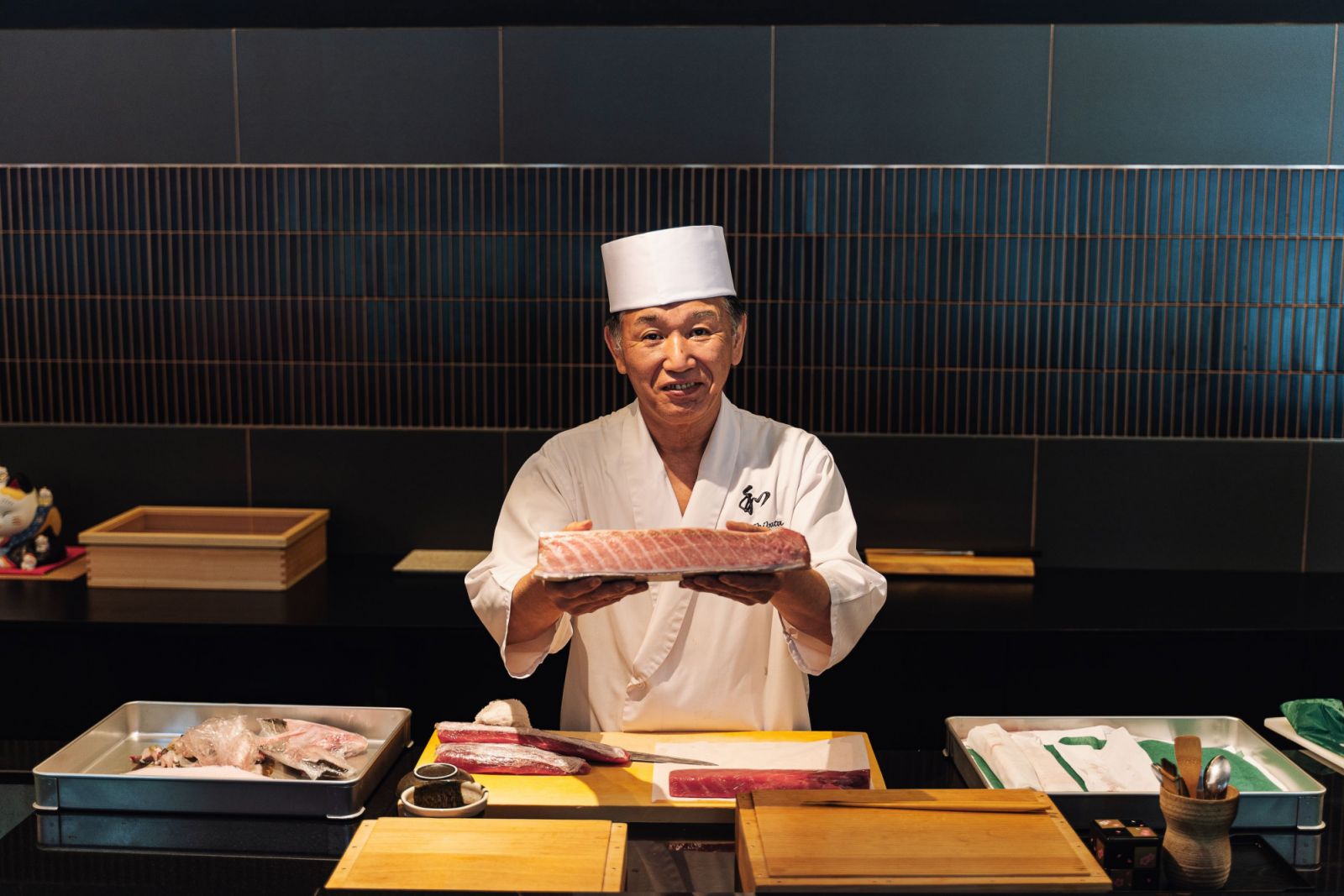Shibata preps and slices his fish before every service