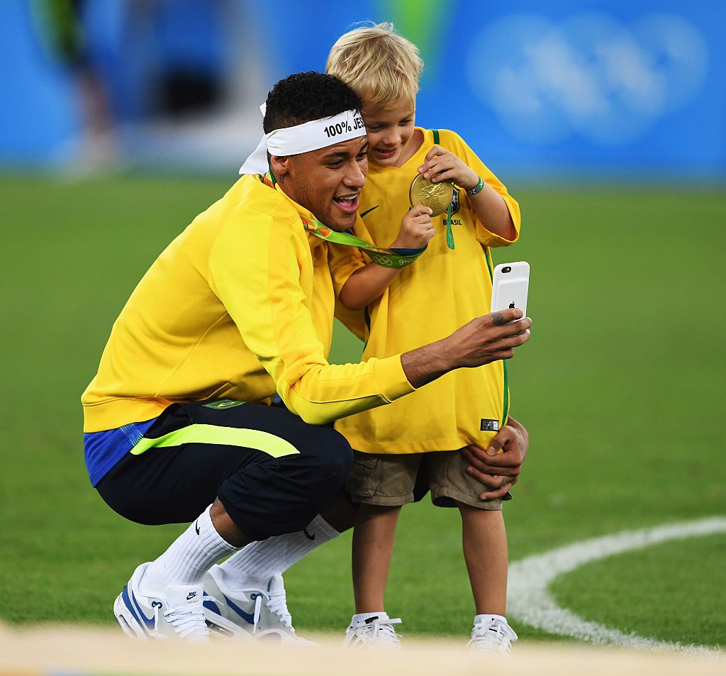 RIO DE JANEIRO, BRAZIL - AUGUST 20: Neymar of Brazil celebrates with his son at the Olympic Men's Final Football match between Brazil and Germany at Maracana Stadium on August 20, 2016 in Rio de Janeiro, Brazil. (Photo by Stuart Franklin - FIFA/FIFA via Getty Images)(Photo: Getty Images)