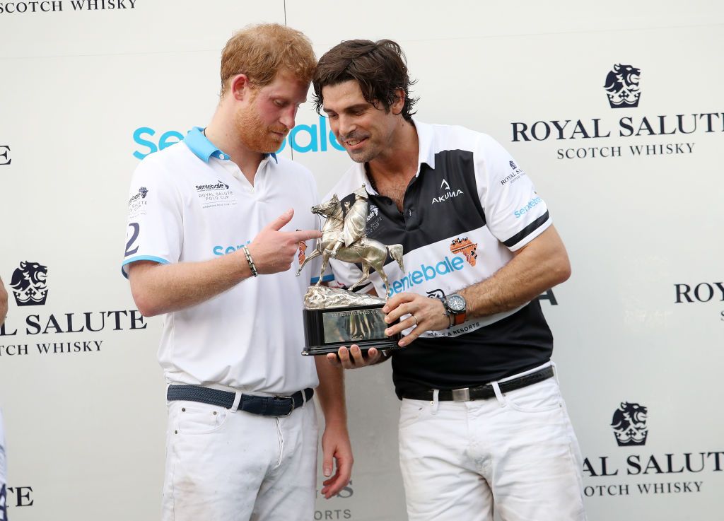 SINGAPORE - JUNE 05: Prince Harry lets Argentine player and Sentebale ambassador Nacho Figueras hold the trophy after the Sentebale Royal Salute Polo Cup on June 5, 2017 in Singapore. The Sentebale Royal Salute Polo Cup is held to raise funds for Prince Harry's charity Sentebale, which supports vulnerable children and young people living with HIV in Lesotho and Botswana.(Photo by Chris Jackson/Getty Images for Royal Salute)