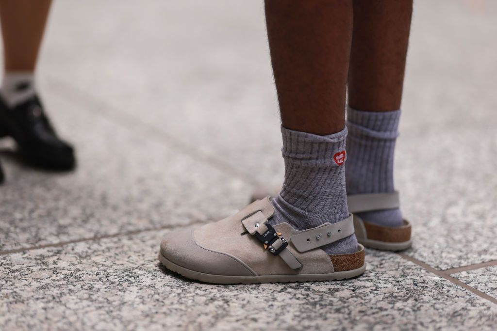 NEW YORK, NEW YORK - SEPTEMBER 13: A fashion week guest seen wearing dior by birkenstock shoes, outside peter do during New York Fashion Week on September 13, 2022 in New York C. (Photo by Jeremy Moeller/Getty Images)