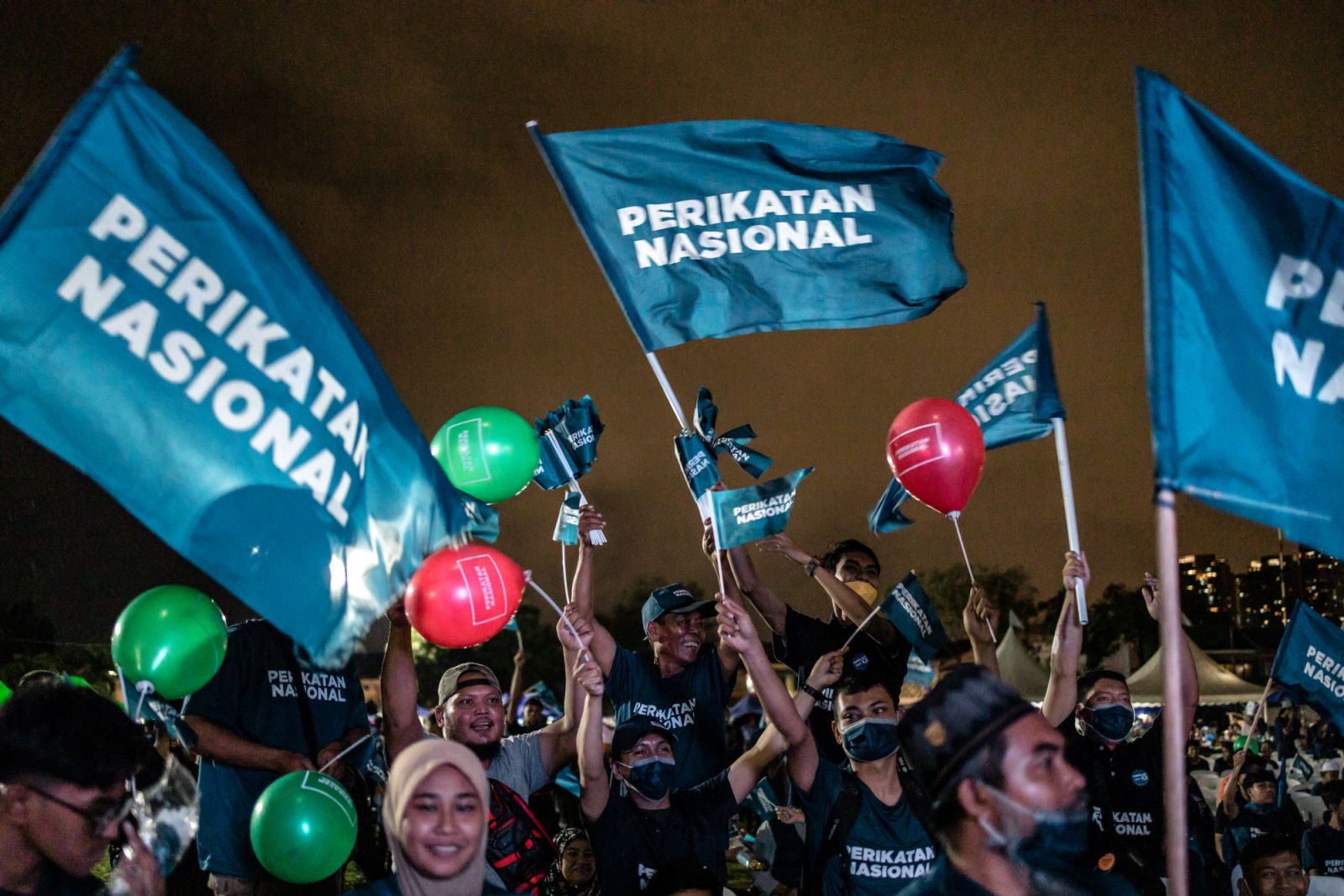 Supporters of Malaysia's former Prime Minister and the leader of Perikatan Nasional (National Alliance) Muhyiddin Yassin attend an election campaign rally ahead of the country's 15th general election on November 14, 2022 in Kuala Lumpur, Malaysia. Malaysia's 15th general election will be held on November 19. (Photo by Mohd Firdaus/NurPhoto via Getty Images)