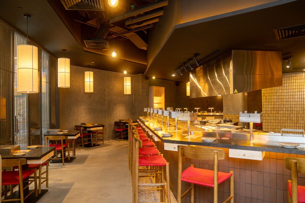 Interior showcases the island charcoal bar