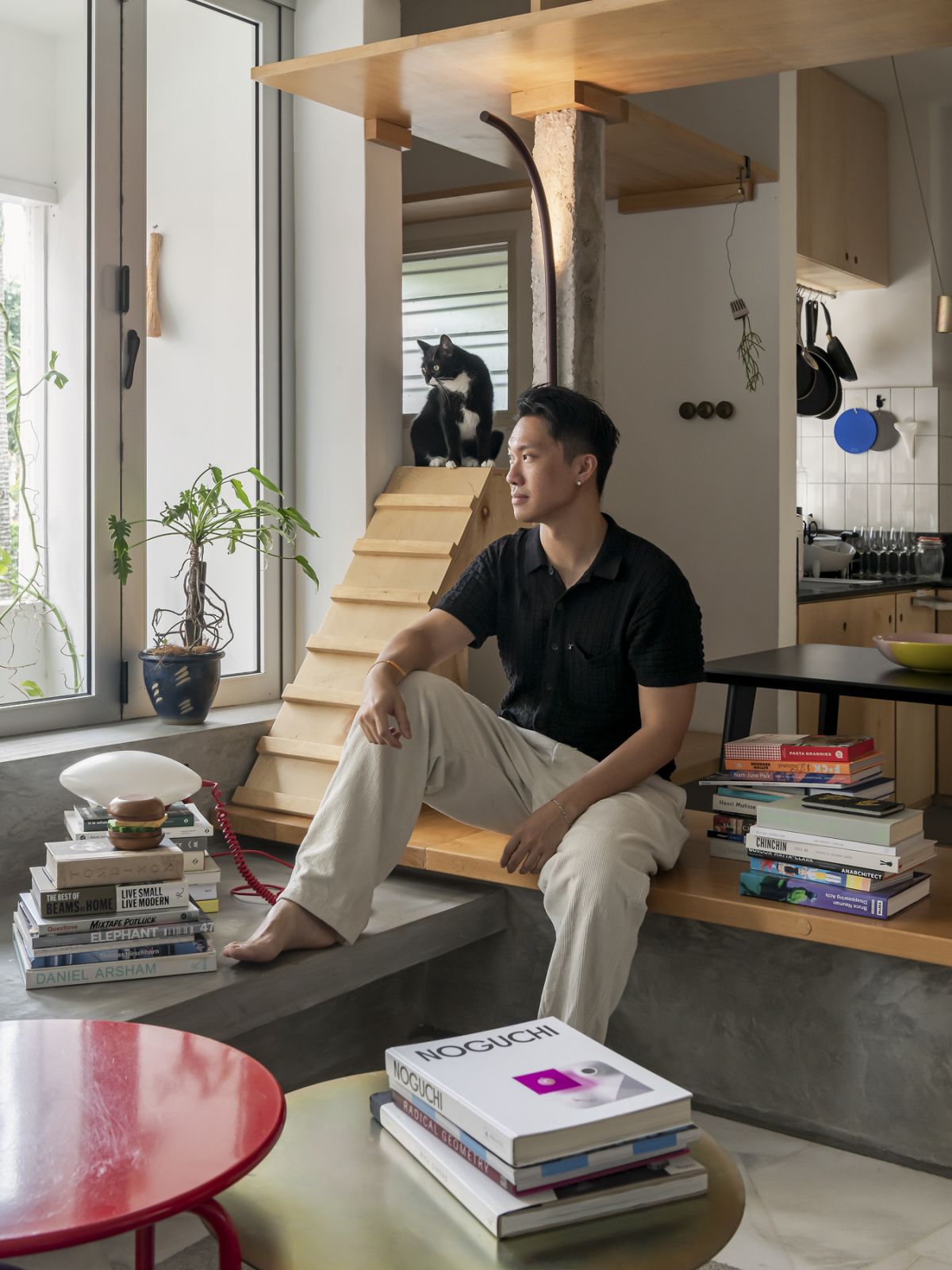 Jun Ong, co-founder of POW Ideas and Jasper, tuxedo cat (Photo: David Yeow)