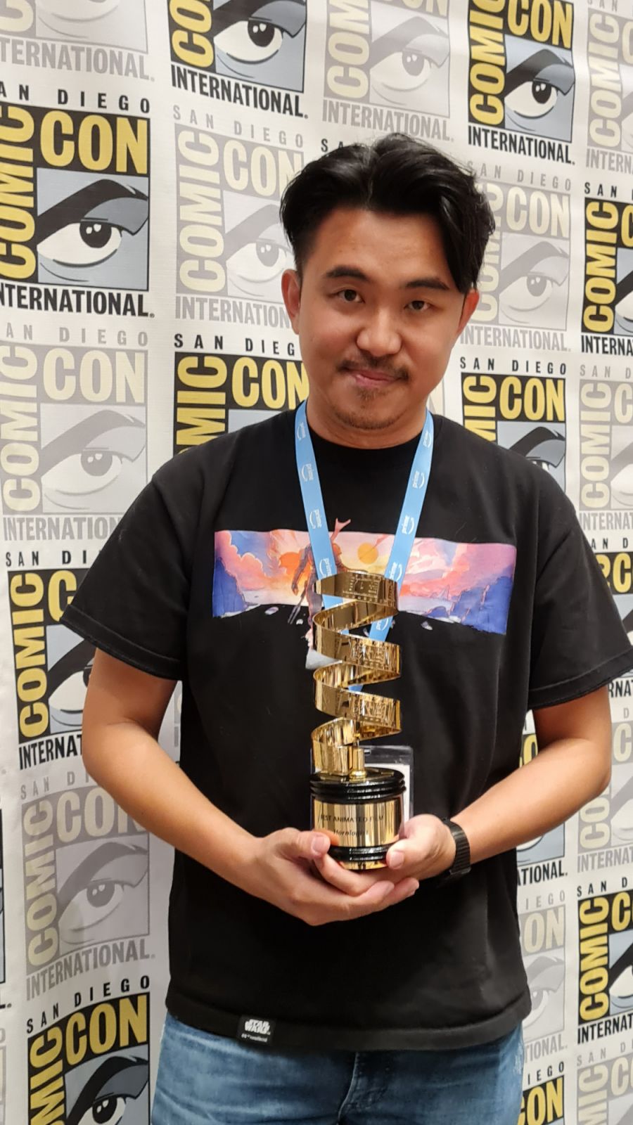 Grim Film founder Jared Lee with the Best Animation award at SDCC Film Festival 2023