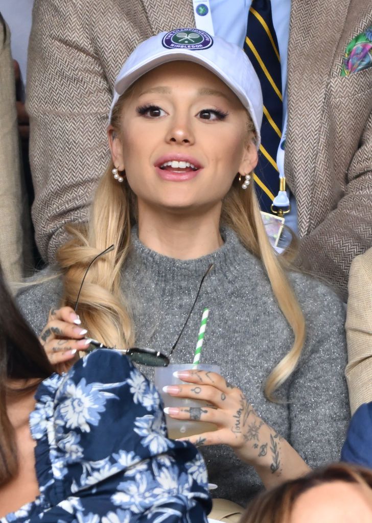 LONDON, ENGLAND - JULY 16: Ariana Grande watches Carlos Alcaraz vs Novak Djokovic in the Wimbledon 2023 men's final on Centre Court during day fourteen of the Wimbledon Tennis Championships at All England Lawn Tennis and Croquet Club on July 16, 2023 in London, England. (Photo by Karwai Tang/WireImage)